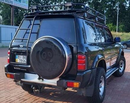 Черный Ниссан Патрол, объемом двигателя 3 л и пробегом 405 тыс. км за 15000 $, фото 4 на Automoto.ua
