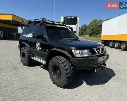 Черный Ниссан Патрол, объемом двигателя 2.95 л и пробегом 326 тыс. км за 16000 $, фото 4 на Automoto.ua