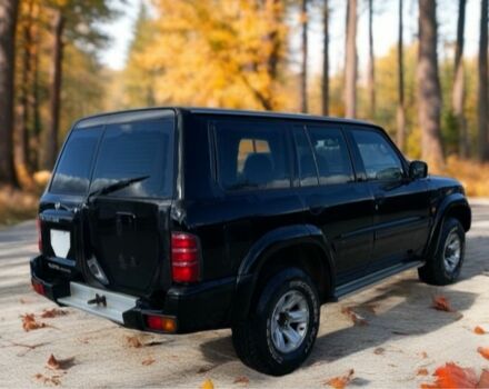 Чорний Ніссан Патрол, об'ємом двигуна 3 л та пробігом 350 тис. км за 7999 $, фото 2 на Automoto.ua