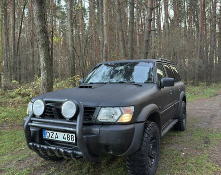 Черный Ниссан Патрол, объемом двигателя 3 л и пробегом 251 тыс. км за 9000 $, фото 1 на Automoto.ua