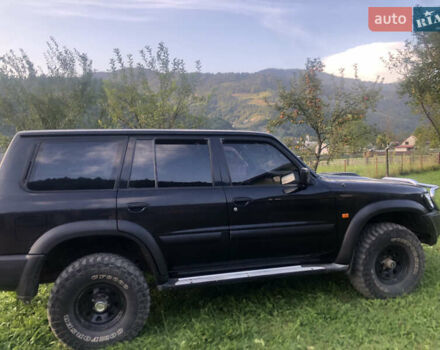 Черный Ниссан Патрол, объемом двигателя 3 л и пробегом 130 тыс. км за 19700 $, фото 2 на Automoto.ua