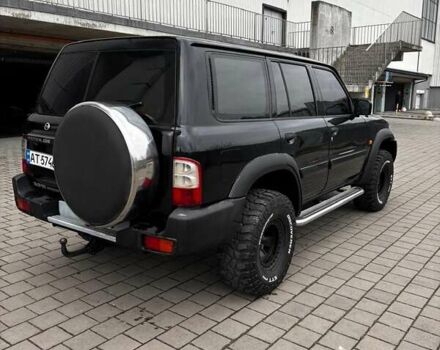 Черный Ниссан Патрол, объемом двигателя 3 л и пробегом 276 тыс. км за 22500 $, фото 2 на Automoto.ua