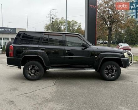 Черный Ниссан Патрол, объемом двигателя 3 л и пробегом 359 тыс. км за 18999 $, фото 7 на Automoto.ua