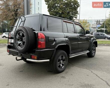 Черный Ниссан Патрол, объемом двигателя 3 л и пробегом 359 тыс. км за 18999 $, фото 6 на Automoto.ua