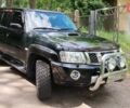 Чорний Ніссан Патрол, об'ємом двигуна 3 л та пробігом 230 тис. км за 23500 $, фото 1 на Automoto.ua