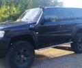 Чорний Ніссан Патрол, об'ємом двигуна 3 л та пробігом 320 тис. км за 17500 $, фото 3 на Automoto.ua