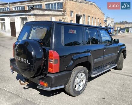 Черный Ниссан Патрол, объемом двигателя 3 л и пробегом 203 тыс. км за 21000 $, фото 4 на Automoto.ua