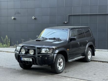 Чорний Ніссан Патрол, об'ємом двигуна 3 л та пробігом 267 тис. км за 5850 $, фото 1 на Automoto.ua