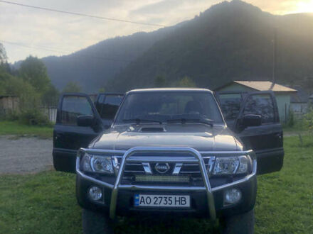 Чорний Ніссан Патрол, об'ємом двигуна 3 л та пробігом 130 тис. км за 19700 $, фото 1 на Automoto.ua