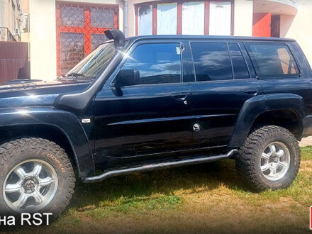 Ніссан Патрол 2004 у Харкові на Automoto.ua Чорний Ніссан Патрол, об'ємом двигуна 3 л та пробігом 232 тис. км за 12700 $, фото 1 на Automoto.ua