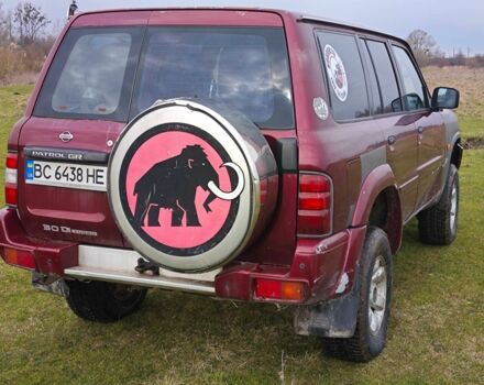 Красный Ниссан Патрол, объемом двигателя 3 л и пробегом 327 тыс. км за 11000 $, фото 5 на Automoto.ua