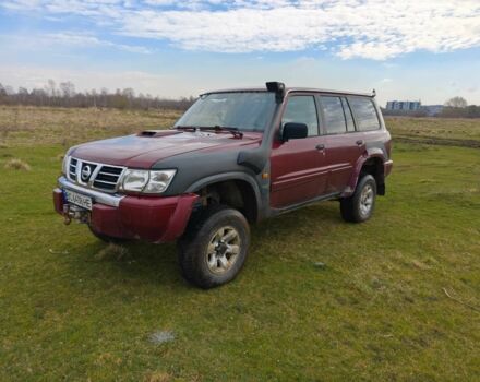 Красный Ниссан Патрол, объемом двигателя 3 л и пробегом 327 тыс. км за 11000 $, фото 1 на Automoto.ua