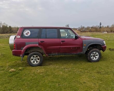 Красный Ниссан Патрол, объемом двигателя 3 л и пробегом 327 тыс. км за 11000 $, фото 4 на Automoto.ua