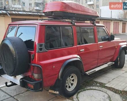 Красный Ниссан Патрол, объемом двигателя 2.8 л и пробегом 413 тыс. км за 12890 $, фото 7 на Automoto.ua