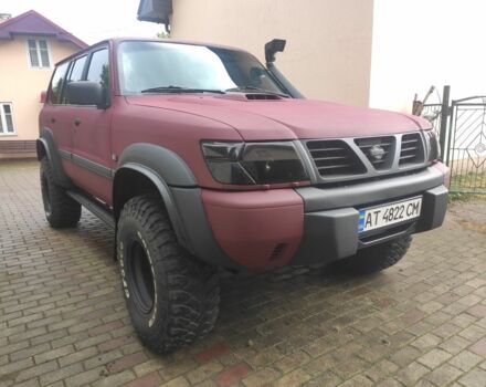 Красный Ниссан Патрол, объемом двигателя 3 л и пробегом 250 тыс. км за 35000 $, фото 2 на Automoto.ua