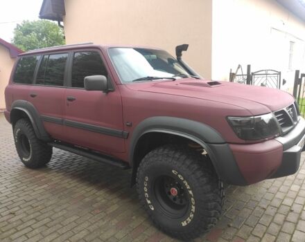 Красный Ниссан Патрол, объемом двигателя 3 л и пробегом 250 тыс. км за 35000 $, фото 3 на Automoto.ua