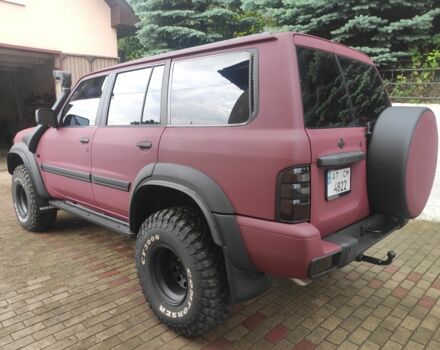 Красный Ниссан Патрол, объемом двигателя 3 л и пробегом 250 тыс. км за 35000 $, фото 6 на Automoto.ua