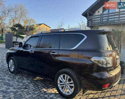 Красный Ниссан Патрол, объемом двигателя 5.55 л и пробегом 180 тыс. км за 20000 $, фото 17 на Automoto.ua