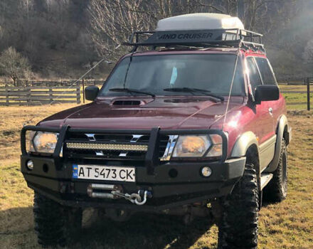 Красный Ниссан Патрол, объемом двигателя 3 л и пробегом 250 тыс. км за 16200 $, фото 1 на Automoto.ua