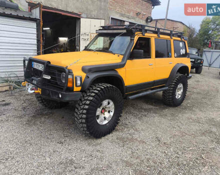 Жовтий Ніссан Патрол, об'ємом двигуна 4.2 л та пробігом 150 тис. км за 30000 $, фото 1 на Automoto.ua