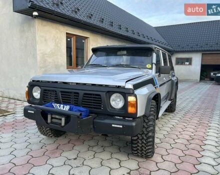 Серый Ниссан Патрол, объемом двигателя 2.8 л и пробегом 234 тыс. км за 9300 $, фото 3 на Automoto.ua