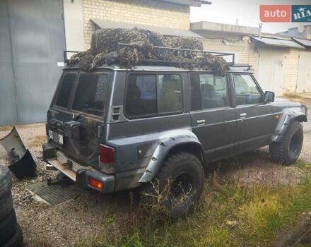 Серый Ниссан Патрол, объемом двигателя 2.8 л и пробегом 300 тыс. км за 12000 $, фото 2 на Automoto.ua