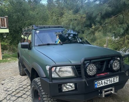 Зеленый Ниссан Патрол, объемом двигателя 4.2 л и пробегом 427 тыс. км за 35000 $, фото 7 на Automoto.ua