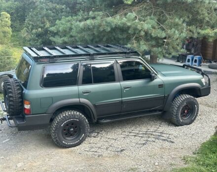 Зеленый Ниссан Патрол, объемом двигателя 4.2 л и пробегом 427 тыс. км за 35000 $, фото 2 на Automoto.ua