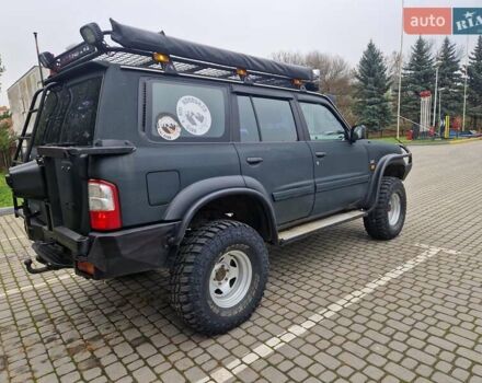 Зелений Ніссан Патрол, об'ємом двигуна 2.8 л та пробігом 198 тис. км за 19999 $, фото 14 на Automoto.ua