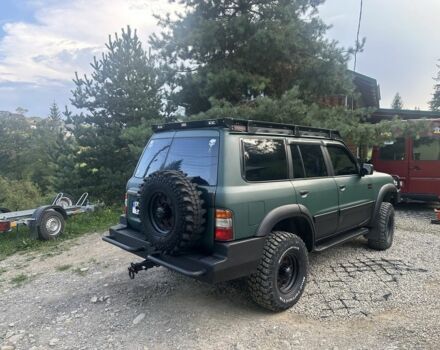 Зеленый Ниссан Патрол, объемом двигателя 4.2 л и пробегом 427 тыс. км за 35000 $, фото 6 на Automoto.ua