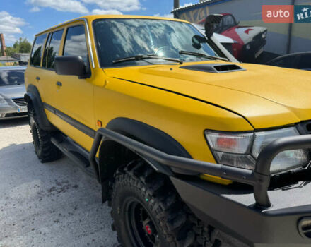 Зеленый Ниссан Патрол, объемом двигателя 4.2 л и пробегом 270 тыс. км за 26800 $, фото 3 на Automoto.ua