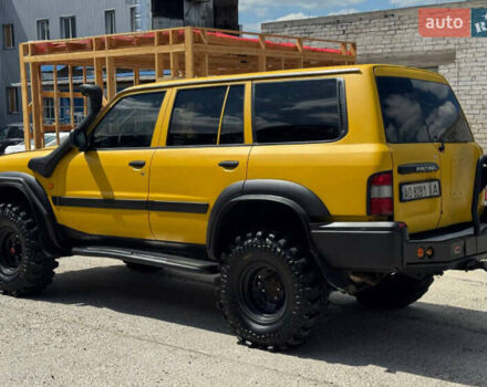 Зеленый Ниссан Патрол, объемом двигателя 4.2 л и пробегом 270 тыс. км за 26800 $, фото 7 на Automoto.ua