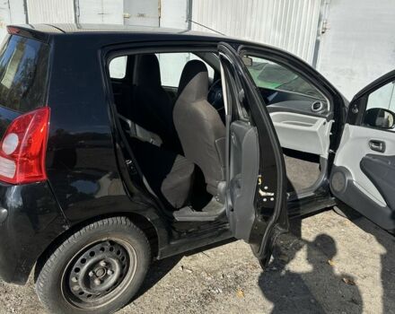 Черный Ниссан Пиксо, объемом двигателя 1 л и пробегом 150 тыс. км за 3300 $, фото 1 на Automoto.ua