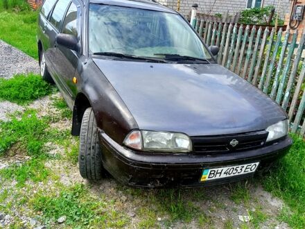 Коричневий Ніссан Прімера, об'ємом двигуна 2 л та пробігом 350 тис. км за 900 $, фото 1 на Automoto.ua