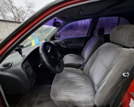 Красный Ниссан Примера, объемом двигателя 2 л и пробегом 323 тыс. км за 2300 $, фото 2 на Automoto.ua