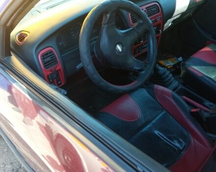 Красный Ниссан Примера, объемом двигателя 1.6 л и пробегом 251 тыс. км за 600 $, фото 2 на Automoto.ua