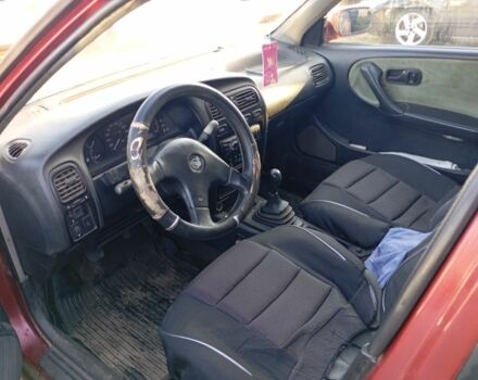 Красный Ниссан Примера, объемом двигателя 2 л и пробегом 273 тыс. км за 1300 $, фото 4 на Automoto.ua