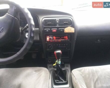 Красный Ниссан Примера, объемом двигателя 1.6 л и пробегом 230 тыс. км за 2500 $, фото 5 на Automoto.ua