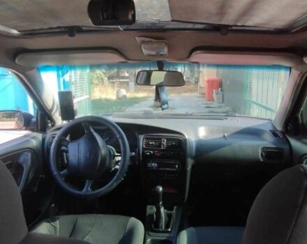 Красный Ниссан Примера, объемом двигателя 1.6 л и пробегом 300 тыс. км за 100000 $, фото 1 на Automoto.ua