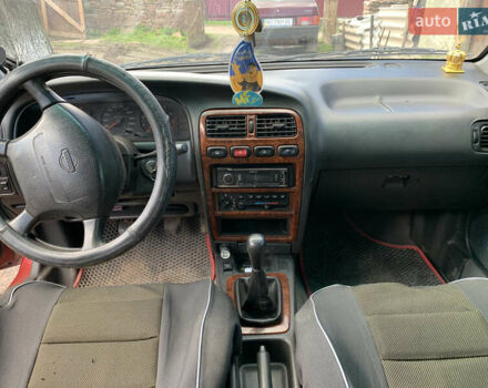 Красный Ниссан Примера, объемом двигателя 2 л и пробегом 329 тыс. км за 1800 $, фото 1 на Automoto.ua