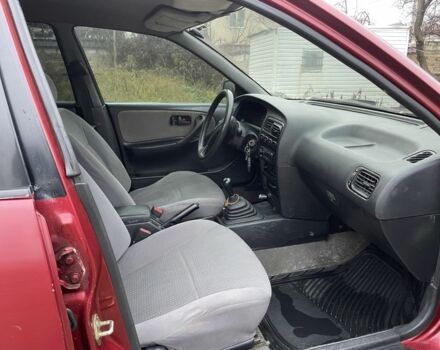 Червоний Ніссан Прімера, об'ємом двигуна 2 л та пробігом 400 тис. км за 1199 $, фото 10 на Automoto.ua