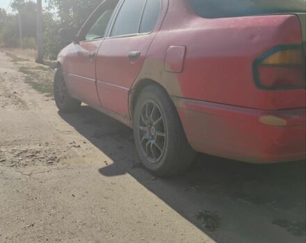 Червоний Ніссан Прімера, об'ємом двигуна 2 л та пробігом 320 тис. км за 1500 $, фото 1 на Automoto.ua