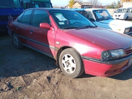 Красный Ниссан Примера, объемом двигателя 2 л и пробегом 273 тыс. км за 1300 $, фото 1 на Automoto.ua
