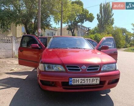 Красный Ниссан Примера, объемом двигателя 2 л и пробегом 297 тыс. км за 2900 $, фото 1 на Automoto.ua
