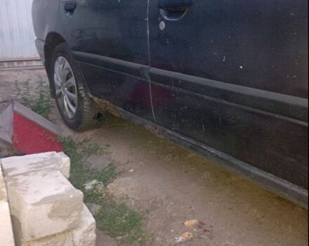 Серый Ниссан Примера, объемом двигателя 1 л и пробегом 300 тыс. км за 600 $, фото 5 на Automoto.ua