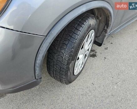 Серый Ниссан Rogue, объемом двигателя 2.49 л и пробегом 177 тыс. км за 12000 $, фото 4 на Automoto.ua