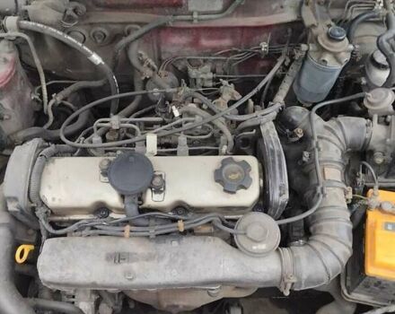 Червоний Ніссан Санні, об'ємом двигуна 2 л та пробігом 692 тис. км за 1902 $, фото 5 на Automoto.ua