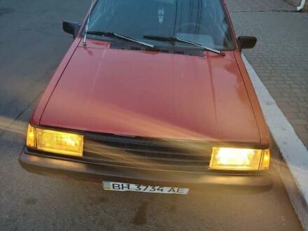 Красный Ниссан Санни, объемом двигателя 1.5 л и пробегом 318 тыс. км за 950 $, фото 1 на Automoto.ua