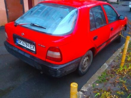 Красный Ниссан Санни, объемом двигателя 1.4 л и пробегом 300 тыс. км за 1450 $, фото 1 на Automoto.ua