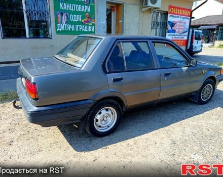 Серый Ниссан Санни, объемом двигателя 1.3 л и пробегом 325 тыс. км за 900 $, фото 1 на Automoto.ua